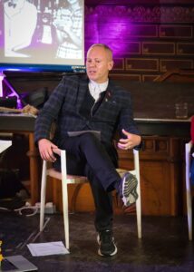 Rob Rinder on stage at Whitby Literature Festival